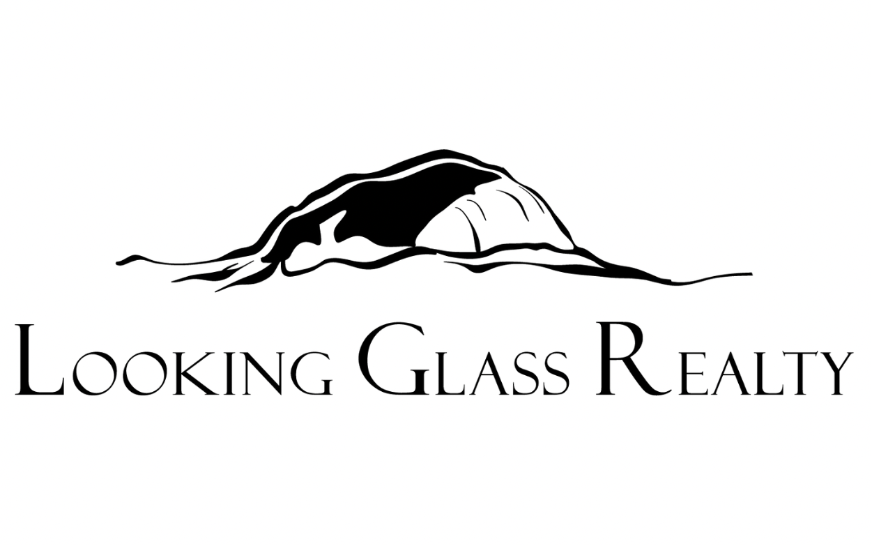 Black and white logo of Looking Glass Realty featuring a stylized mountain silhouette above the company name in bold letters.